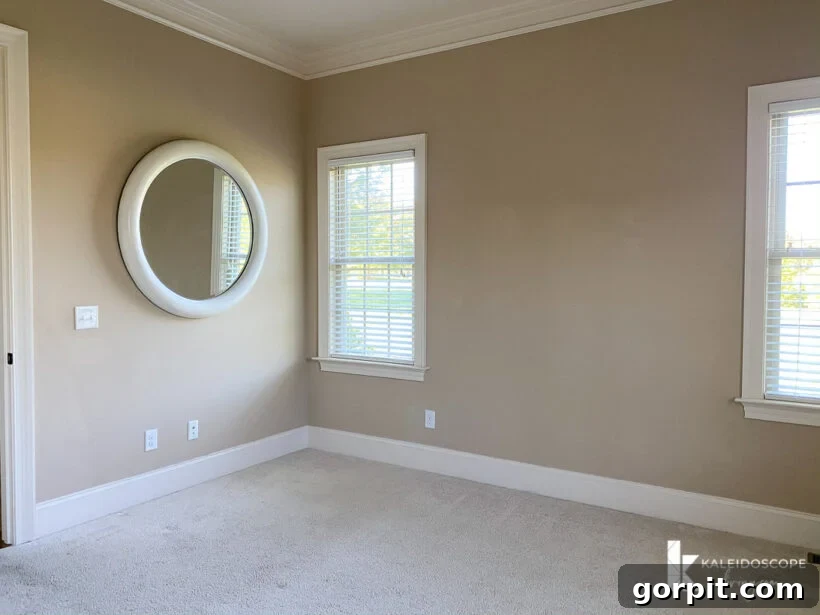 Our New House: The Starting Point Tour Part 1 16 Plain, undecorated guest room with carpet and large windows, awaiting renovation.