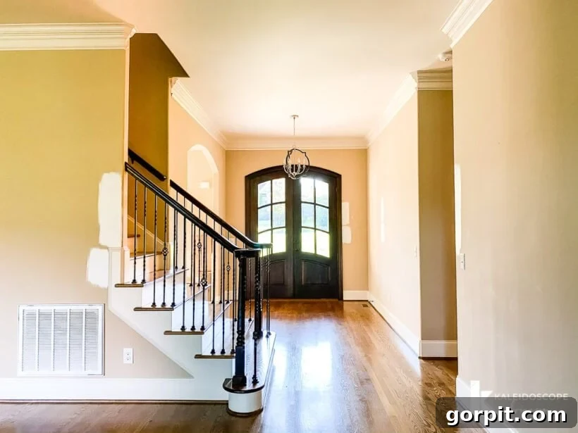 Our New House: The Starting Point Tour Part 1 5 Entryway featuring double front doors, a grand stairwell, and high ceilings.