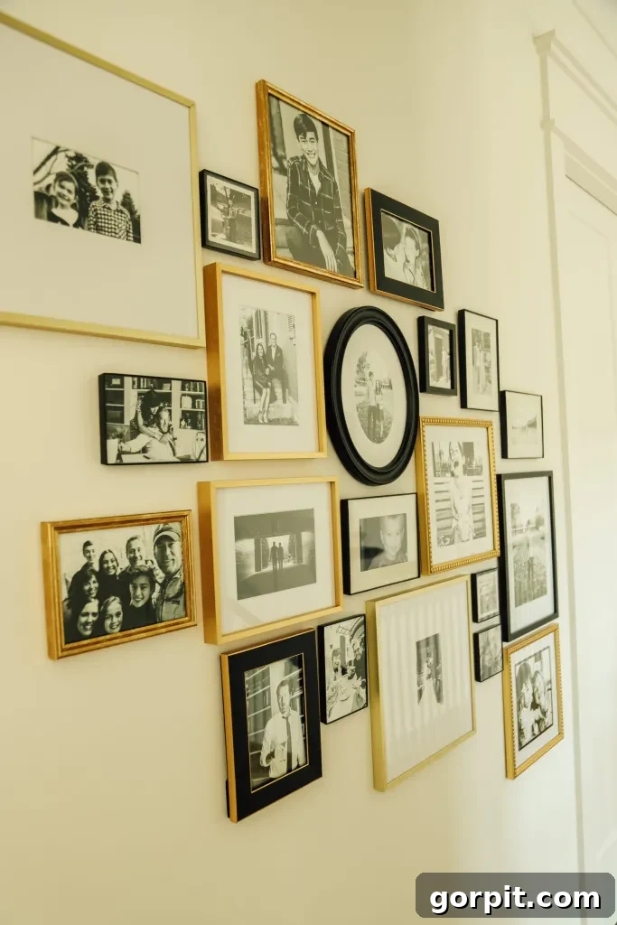 Elegant black and gold gallery wall featuring family photos
