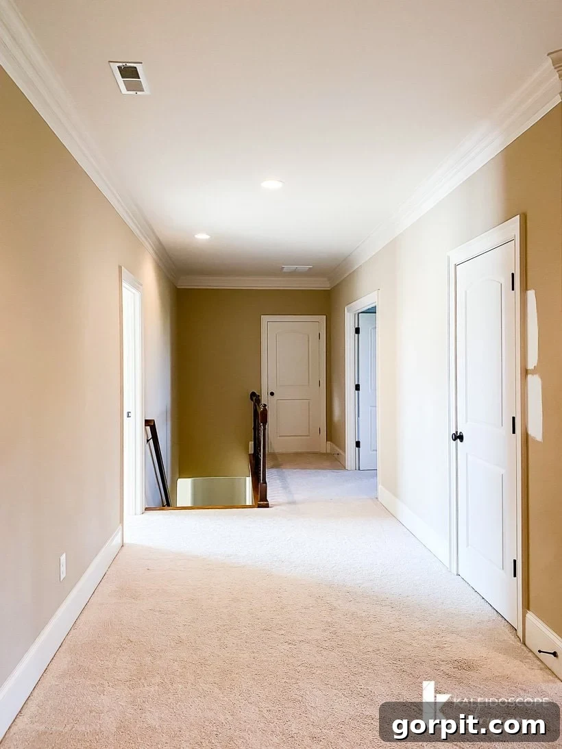 Another angle of the upstairs hallway, highlighting its spaciousness.