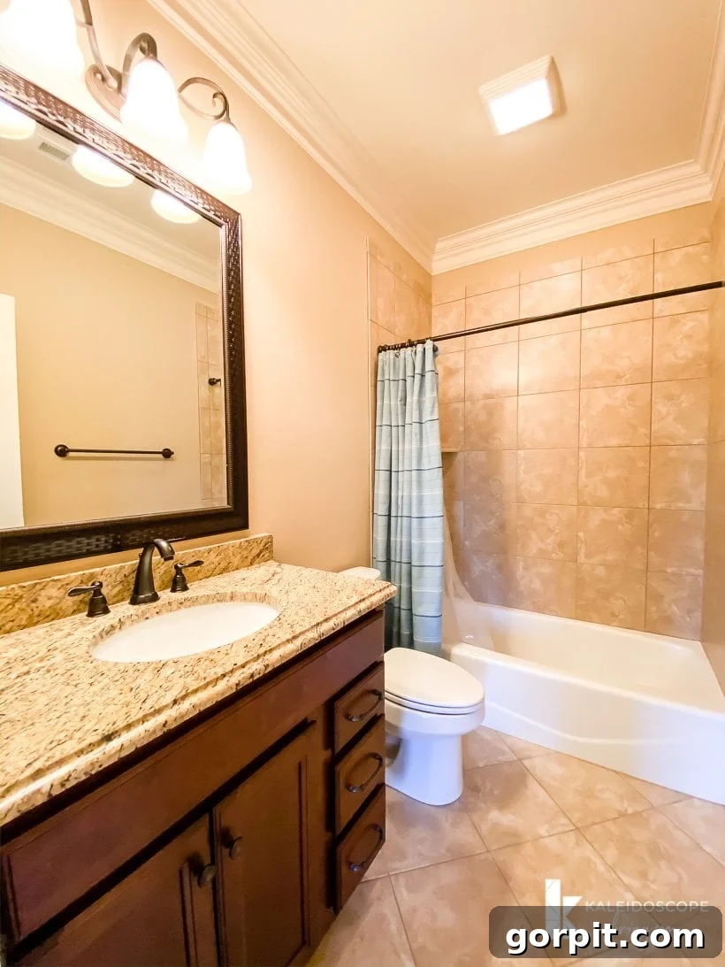 Avery's private bathroom before renovation, showing brown interior.