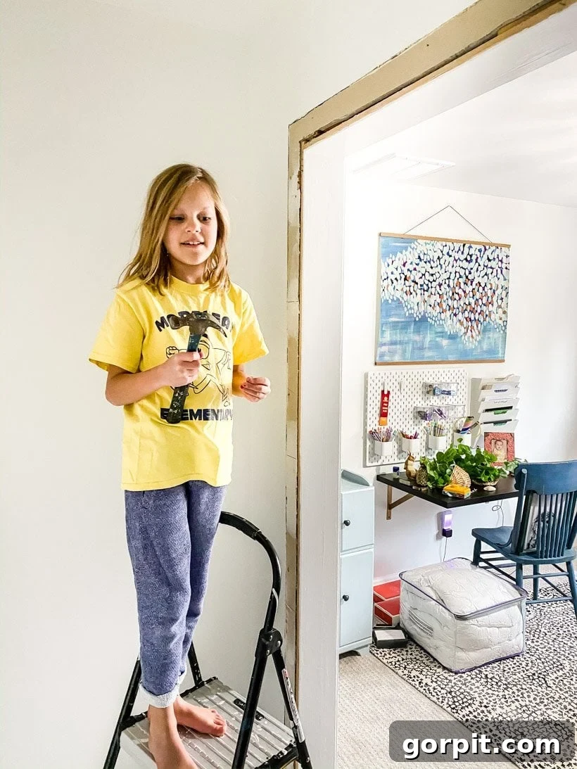 child helping with home improvement project