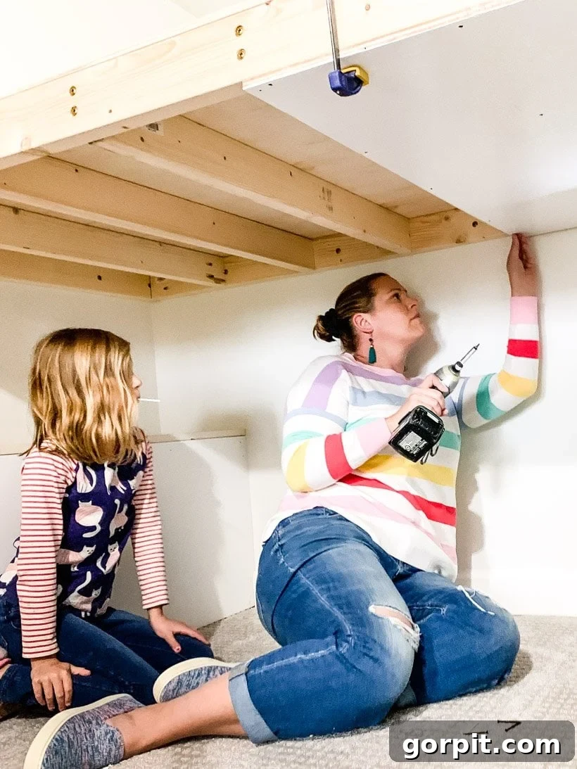mother and daughter building together