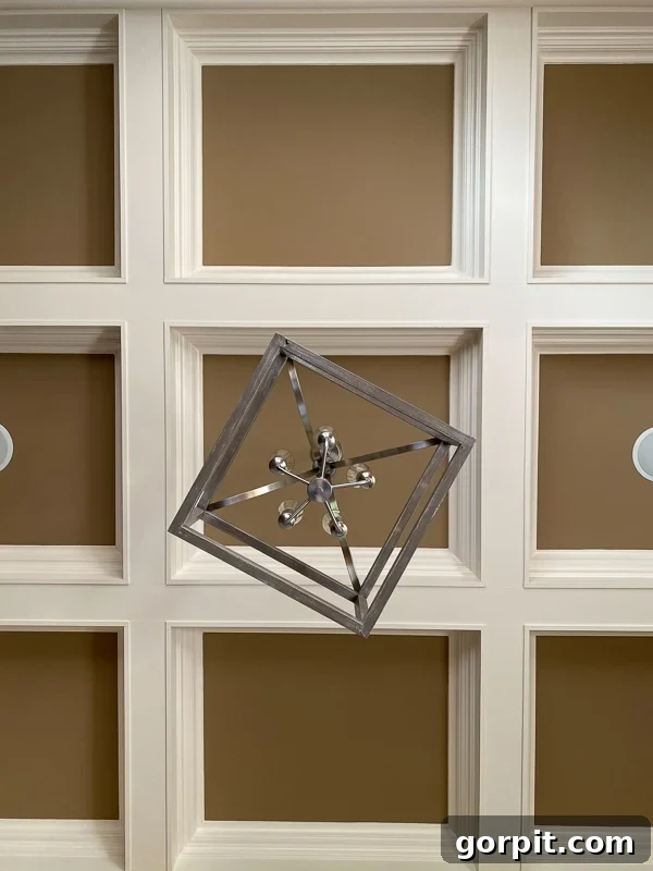 Welcome to Our Navy Dining Room 4 Before the navy-blue dining room, it was this traditional beige and cream-colored coffered ceiling with a square light fixture