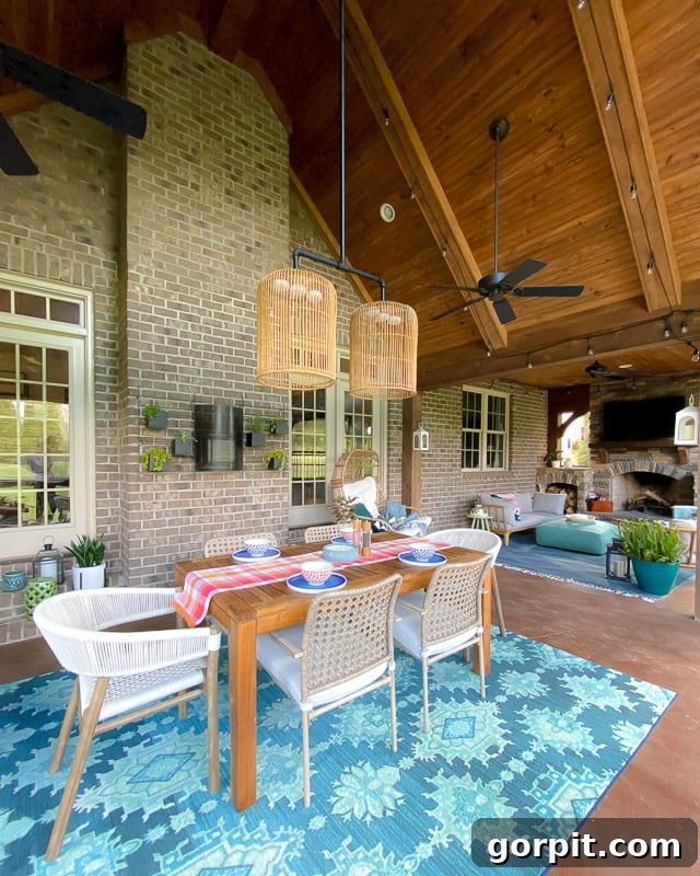 A brightly decorated screened-in porch, showcasing colorful pillows, comfortable seating, and a welcoming atmosphere.
