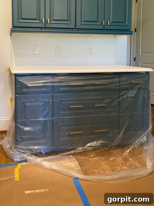 protect cabinets while painting countertops with plastic sheeting