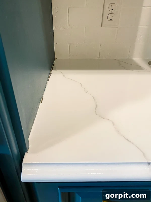 marble painted kitchen countertops before caulking by Tasha Agruso of Kaleidoscope Living