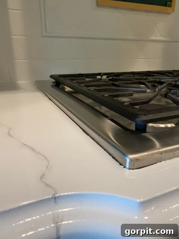 marble painted kitchen countertops before caulking by Tasha Agruso of Kaleidoscope Living
