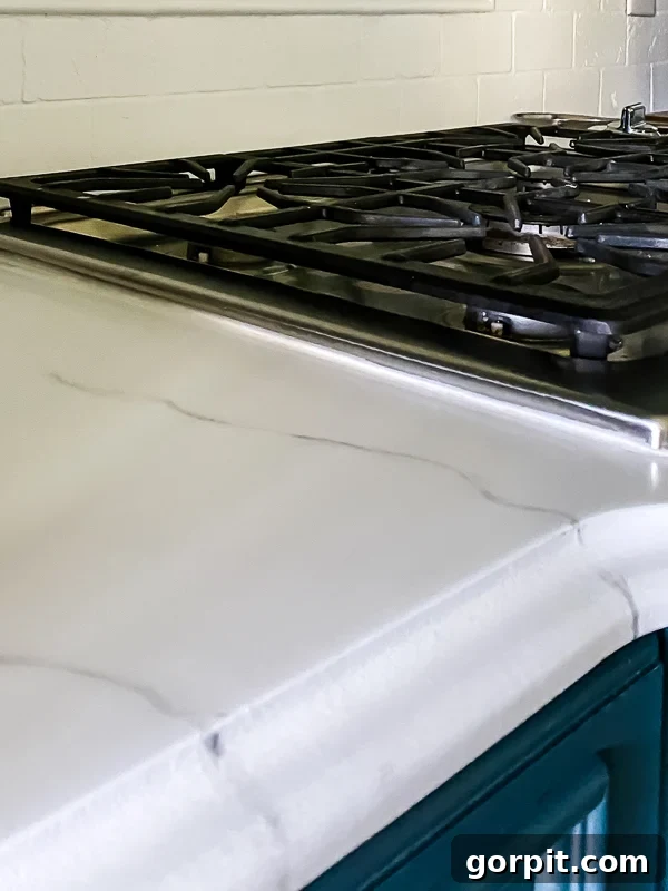 marble painted kitchen countertops after caulking by Tasha Agruso of Kaleidoscope Living