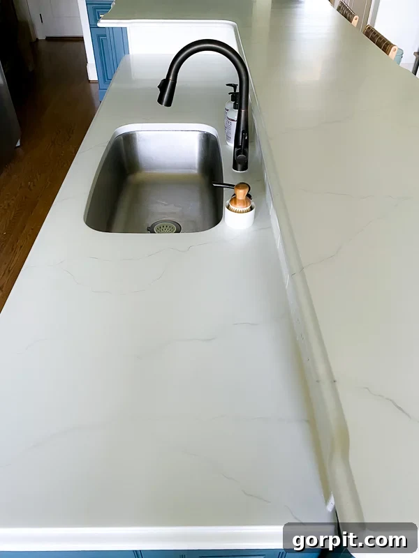 granite countertops painted to look like honed marble by Tasha Agruso of Kaleidoscope Living, showing a polished but not overly glossy finish
