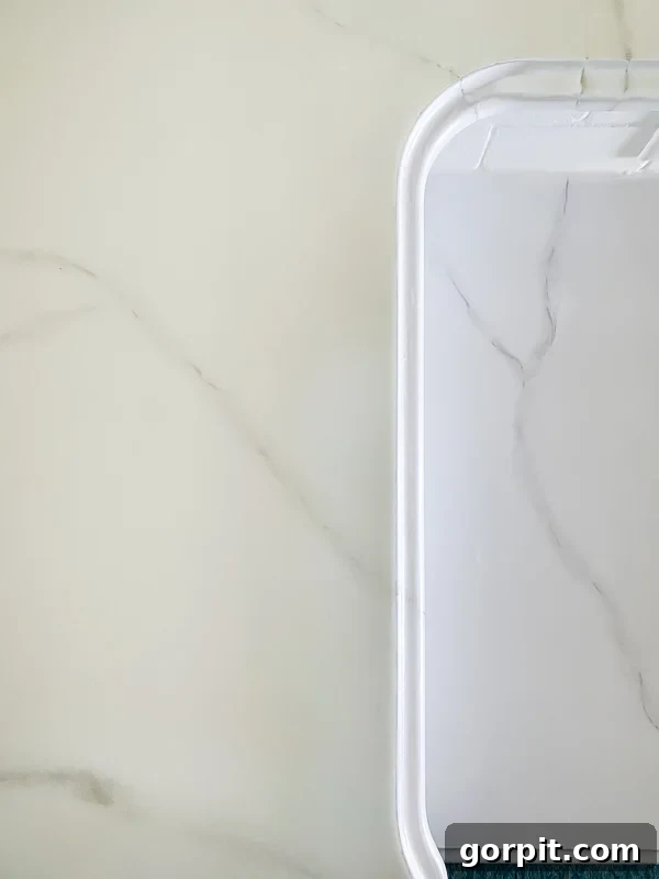 countertop paint- DIY painted countertops to look like marble by Tasha Agruso of Kaleidoscope Living, showing detailed marble effect