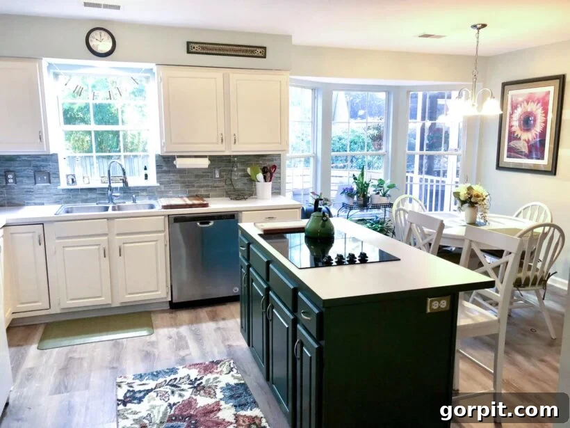After: Bright, modern kitchen with freshly painted cabinets and a stylish new backsplash, dramatically enhancing the space.
