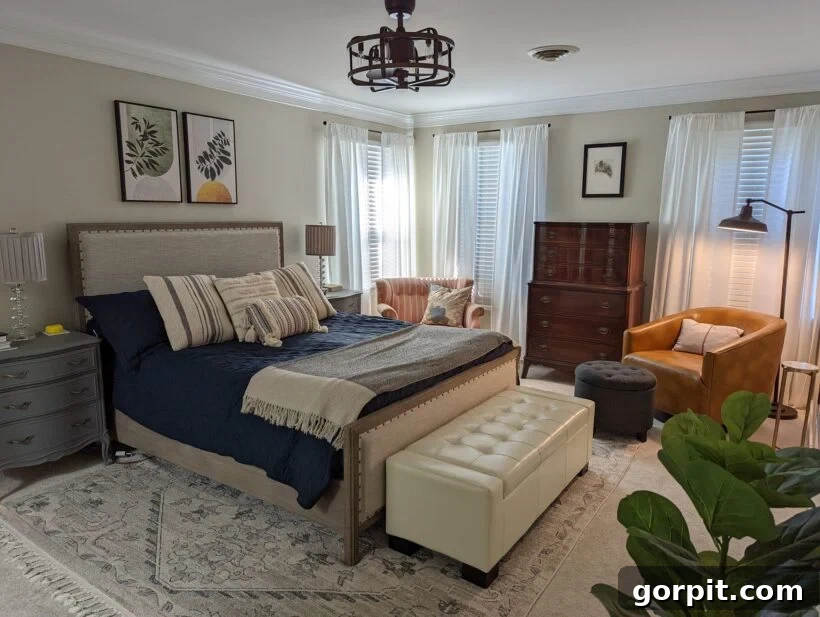 After: Cozy and stylish bedroom with new furniture, artwork, decorative pillows, and elegant curtain panels, creating a welcoming retreat.
