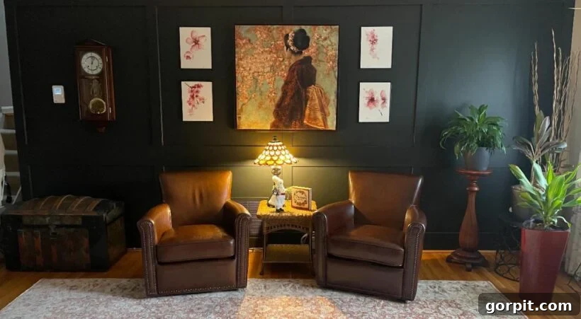 After: Well-defined and cozy nook featuring decorative molding, fresh paint, comfortable leather armchairs, and a perfectly scaled table, creating a distinct space.