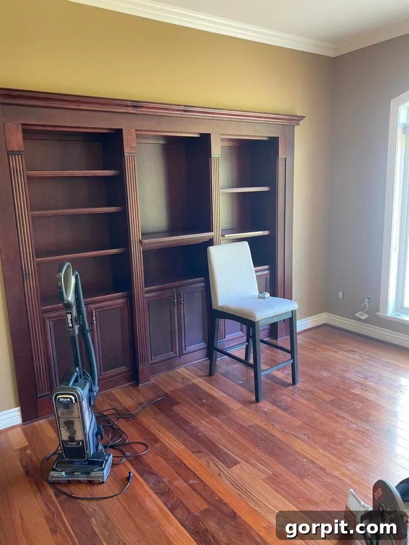 Before: Drab, uninspiring room with a disorganized layout, primarily used for storage.