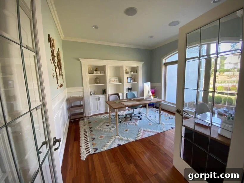 After: Beautiful and functional homeschooling space with a vibrant rug, cohesive color palette, and optimized floor plan, creating an organized learning environment.