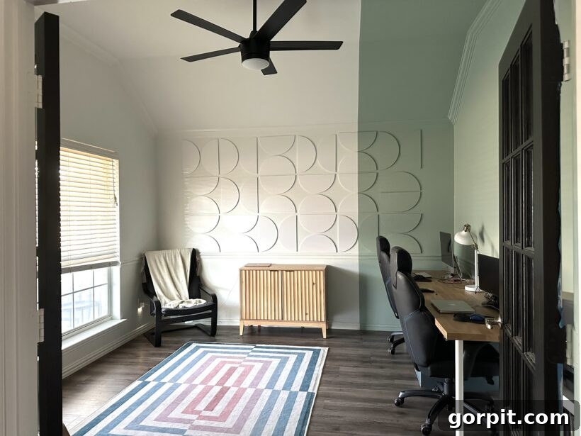 After: Modern and vibrant home office featuring stylish dimensional wall tiles, color-blocked paint, and a chic workspace.