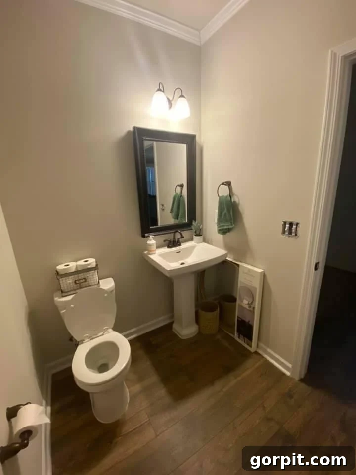 Before: Standard, plain bathroom lacking personality and decorative elements.