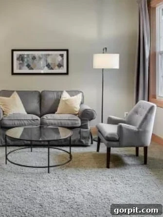 Before: Plain lounge area with simple walls, lacking decorative architectural details.
