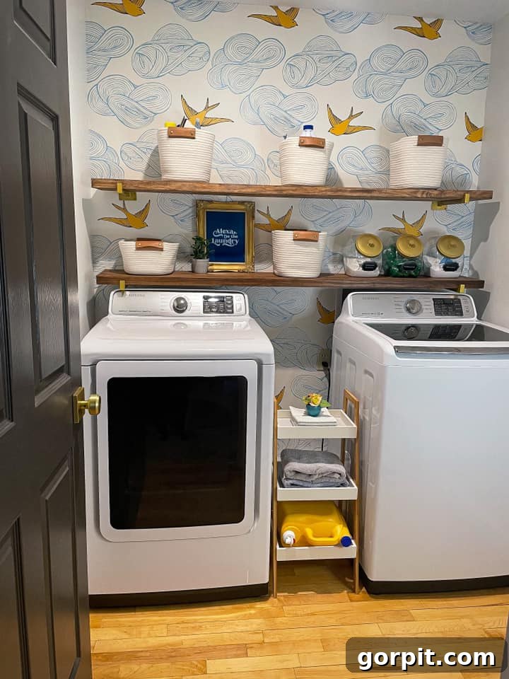 After: Stylish laundry room featuring vibrant patterned wallpaper, adding color and visual interest to the space.