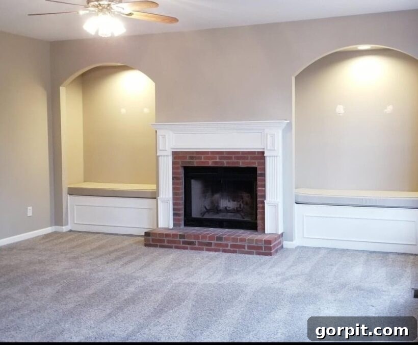 Before: Beige family room with a brick fireplace, appearing traditional and lacking a distinct color scheme.