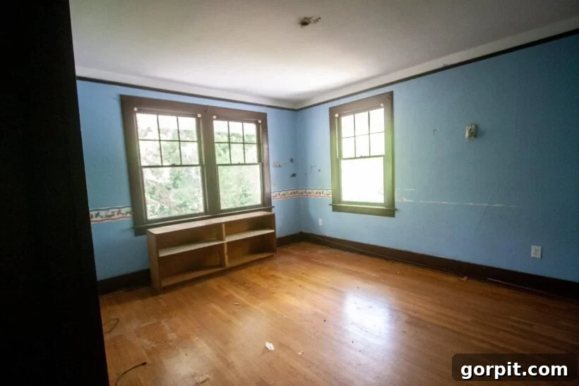 Before: Plain kids' room, likely used for storage, awaiting a vibrant renovation.