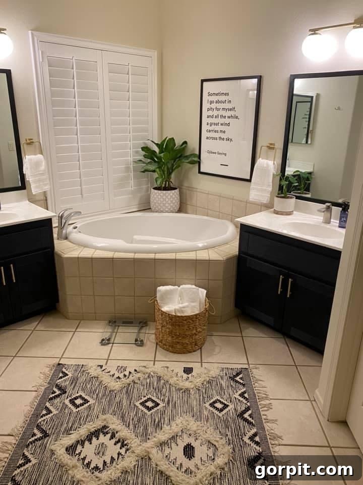 After: Transformed bathroom showcasing painted cabinets in Midnight Blue, updated decor, and a cohesive design, creating a serene and modern oasis.