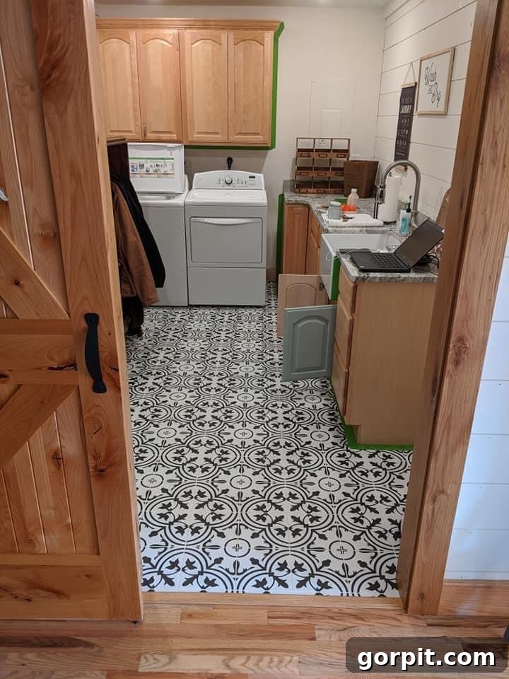 Before: Laundry room with heavy wood trim and cabinets, appearing somewhat dark and dated.
