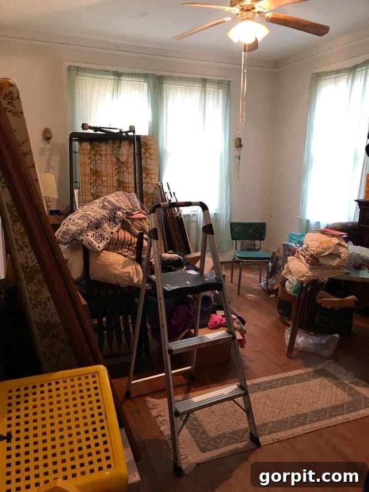Before: Customer's cluttered room, clearly used for storage and lacking any specific functional or aesthetic design.
