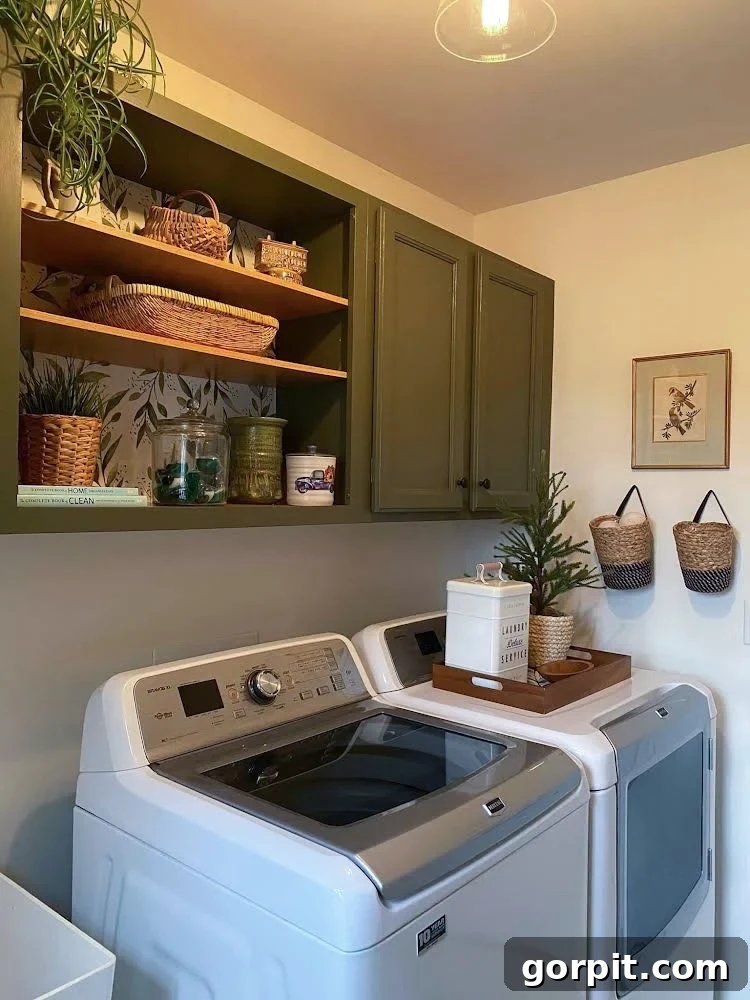 After: Bright and stylish laundry room featuring open shelving, fresh paint, and patterned wallpaper, creating an inviting space.