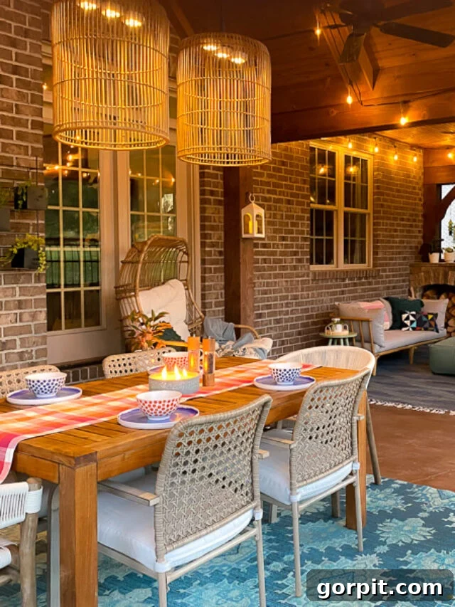 Craft Your Own Outdoor Chandelier 13 image of screened in porch with outdoor chandelier over a dining table with colorful accents and a teal blue rug