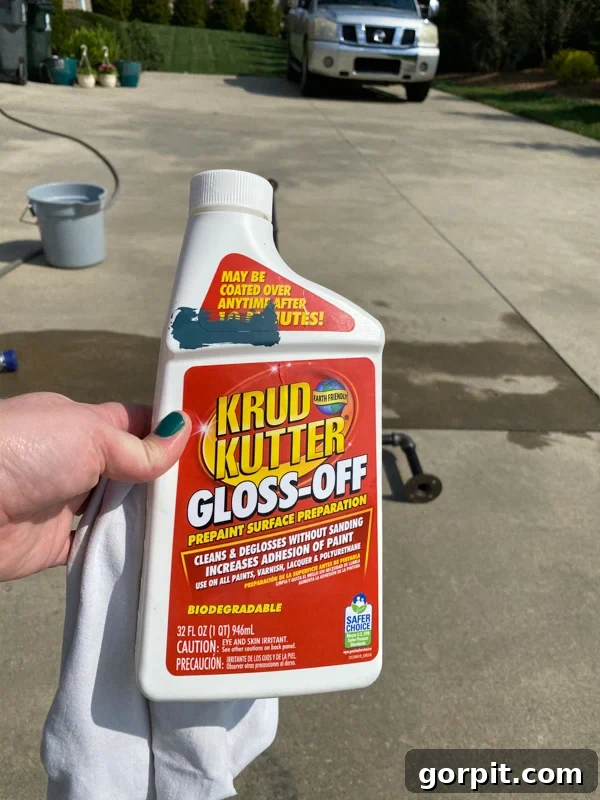 Craft Your Own Outdoor Chandelier 3 image of woman holding Krud Kutter gloss-off cleaner