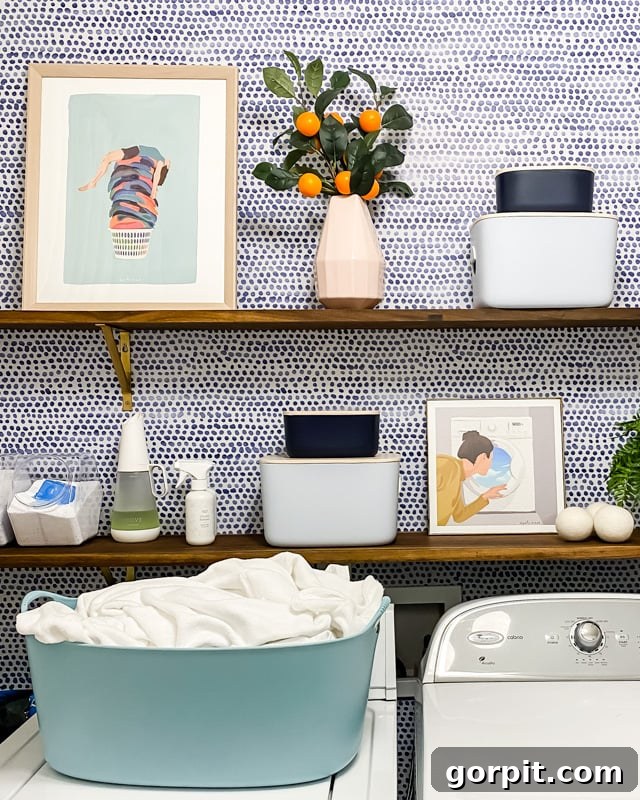 colorful art on open shelves in modern laundry room