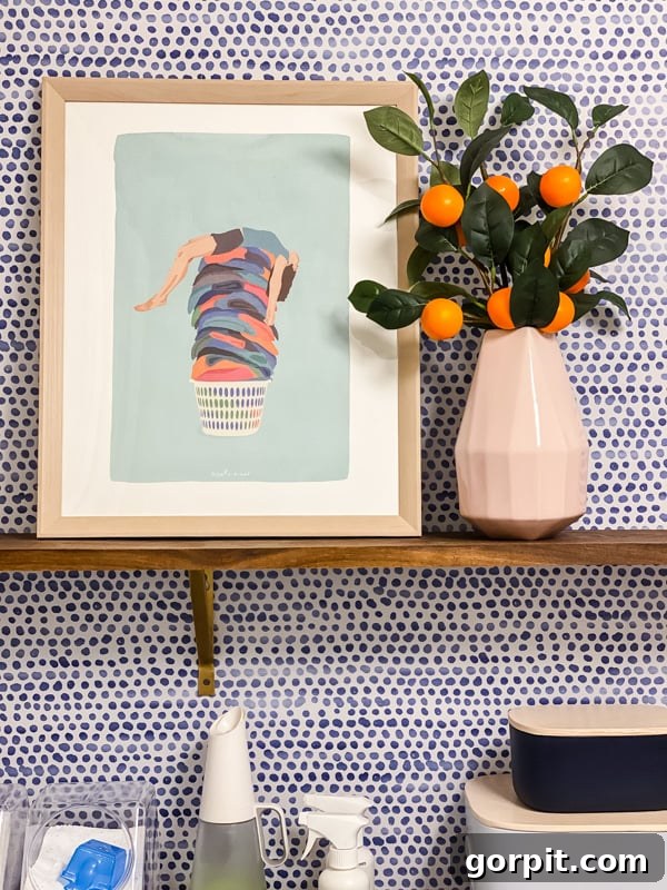 fun laundry art and decor on floating shelves