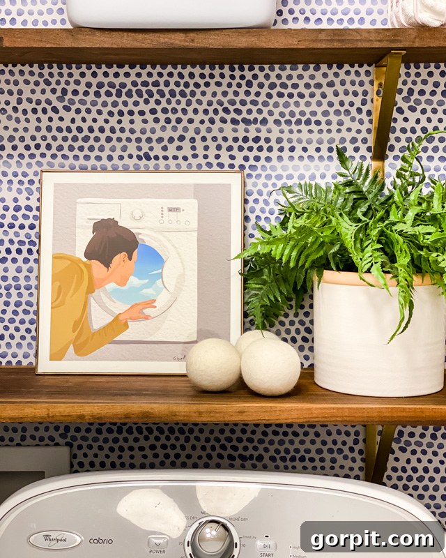 laundry room art on shelves with practical items