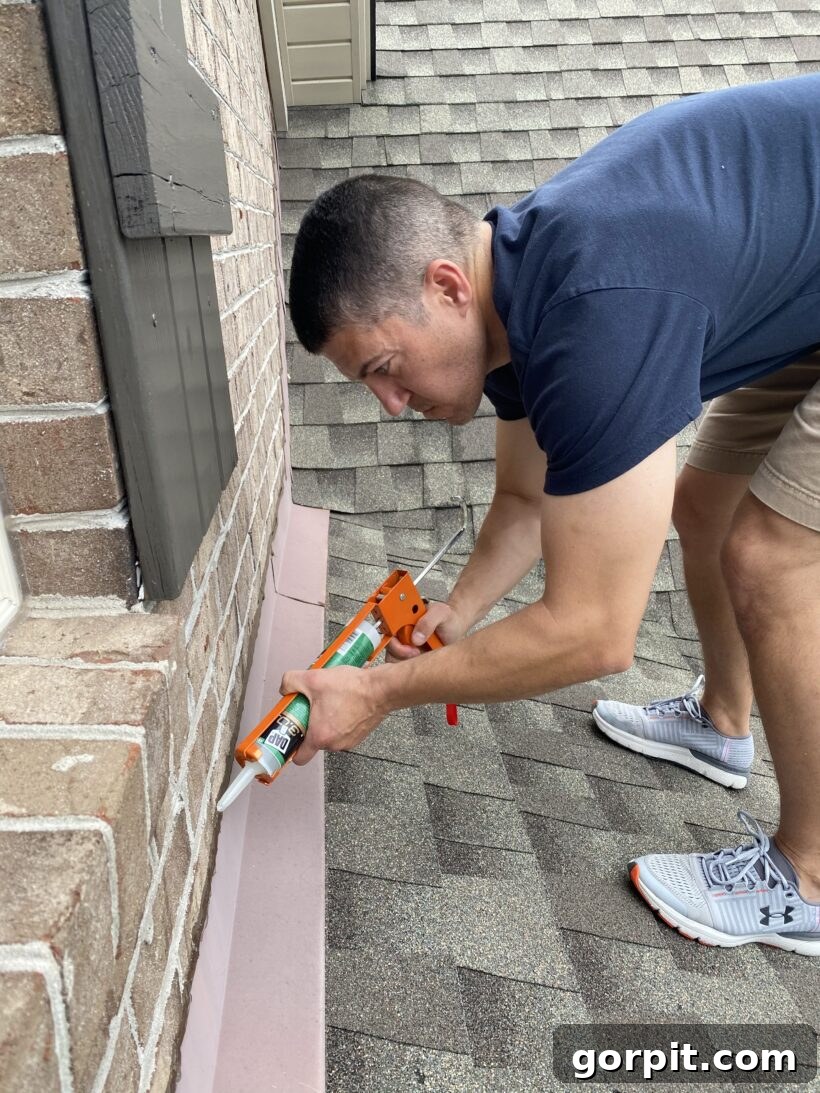Close-up of freshly applied caulk on roof flashing