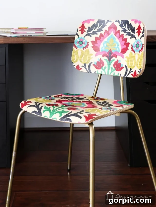Decoupaged fabric on a chic chair, showcasing a budget-friendly furniture makeover