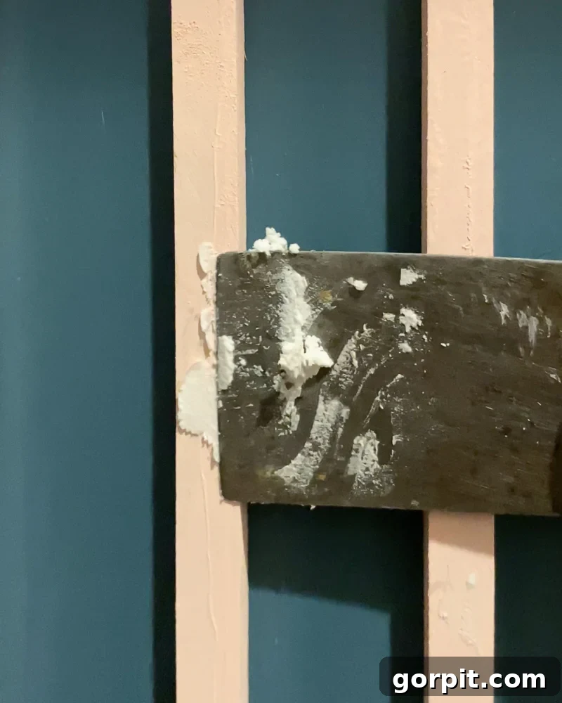 filling nail holes with spackle