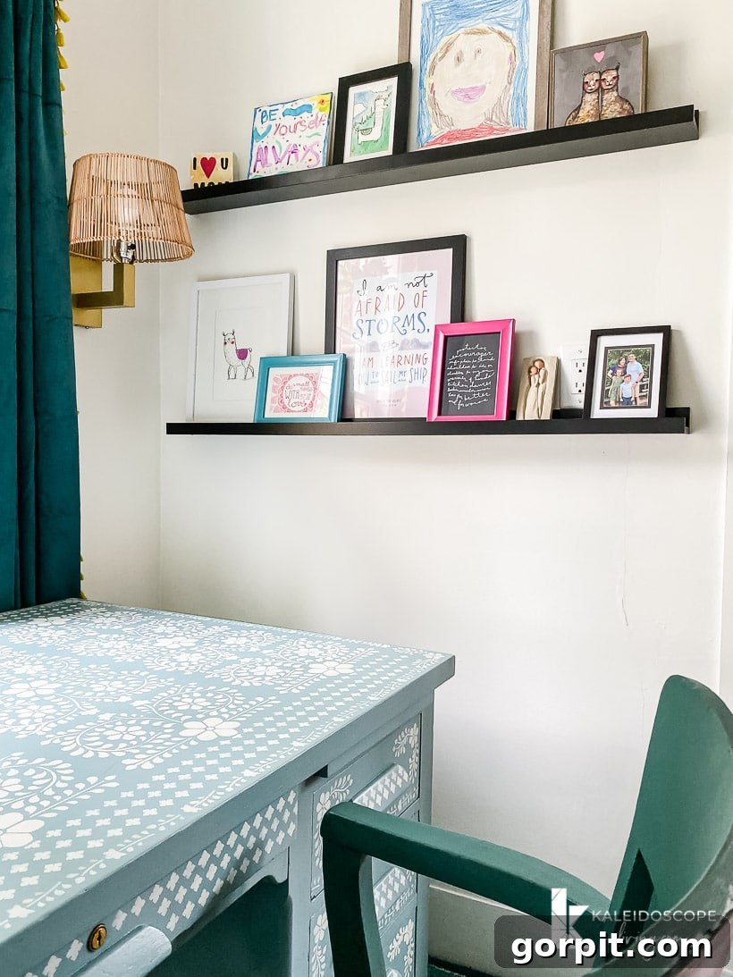 Small Art Big Style Your Guide to Decorating 11 Colorful art displayed on photo ledges in a vibrant office space