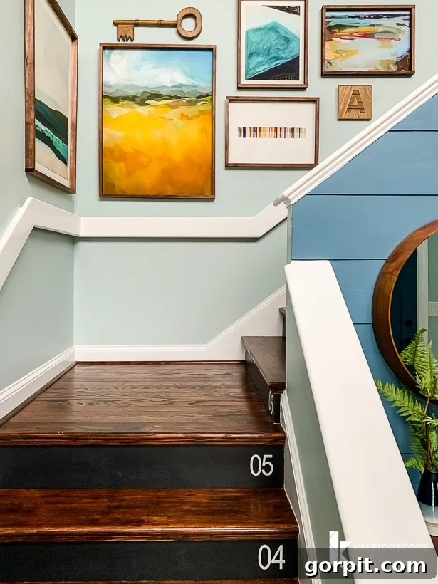 Small Art Big Style Your Guide to Decorating 8 Gallery wall ascending a stairwell, showcasing a mix of large and small art