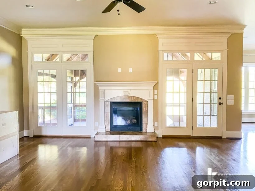 Outdated beige fireplace in a traditional family room setting