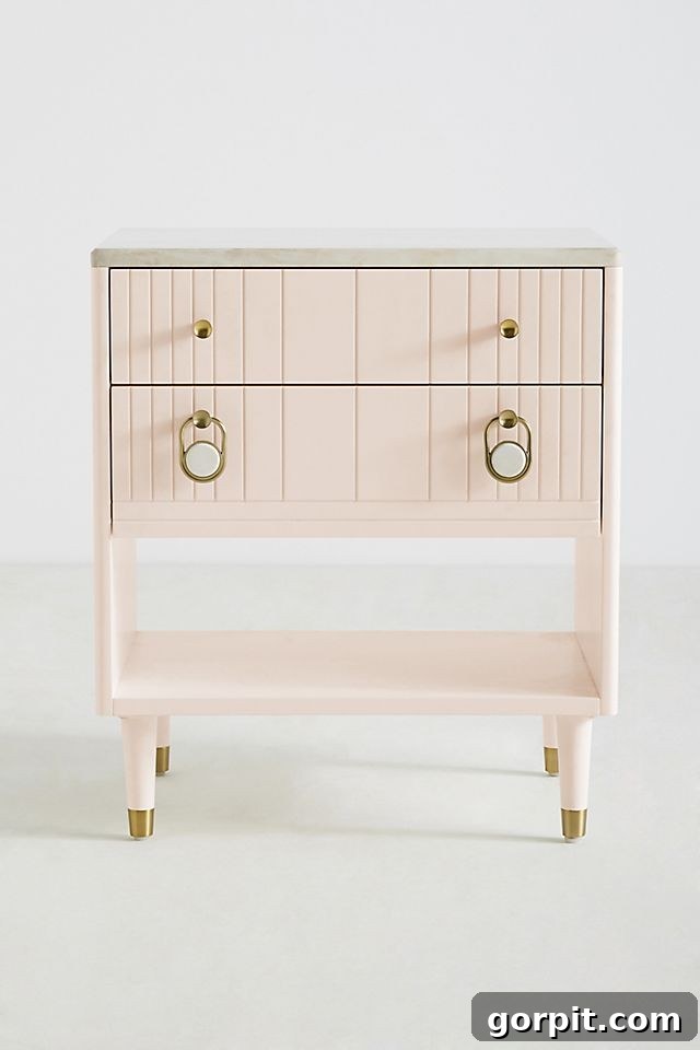 pink bedside table with gold accents