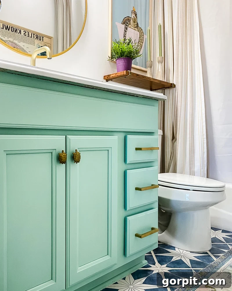 Avery Transforms A Bathroom For Less 12 Transformed bathroom vanity with painted cabinets and charming turtle knobs