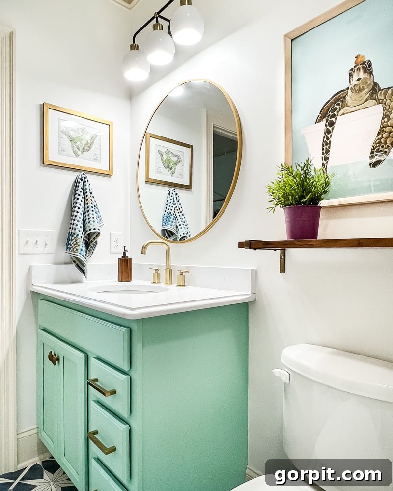 Avery Transforms A Bathroom For Less 18 After image of updated bathroom with painted vanity and new hardware
