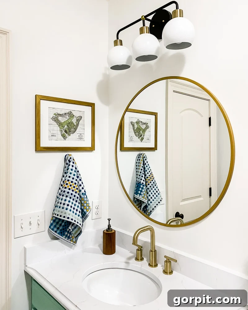 Avery Transforms A Bathroom For Less 9 Details of budget-friendly bathroom makeover with new mirror and faucet