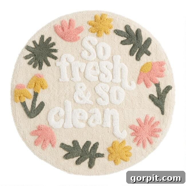 Stylish Bath Mats for Vibrant Bathrooms 4 A round cream-colored bathmat with big border floral images and center text that reads, "so fresh and so clean."