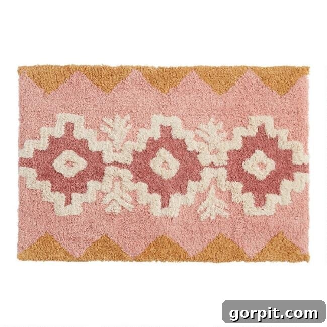 Stylish Bath Mats for Vibrant Bathrooms 7 An overhead product picture of a budget-friendly, rectangular blush and mustard floral Aztec bath mat.