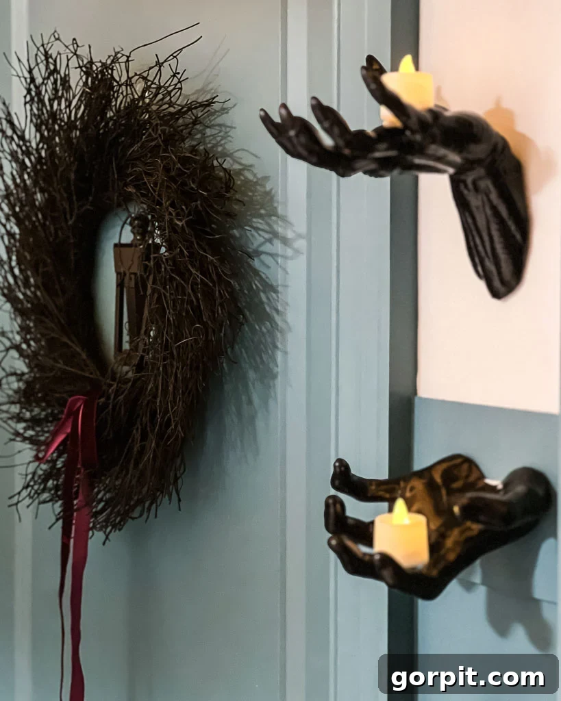 Close-up of a kid's bedroom door with a Halloween wreath and a unique door knocker, enhancing the apartment door look