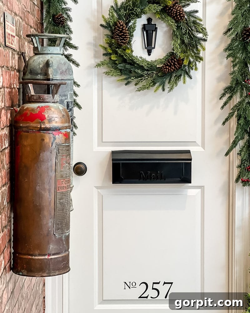 Unique hallway decor featuring brick wallpaper, address numbers with personal significance, and vintage firefighter memorabilia