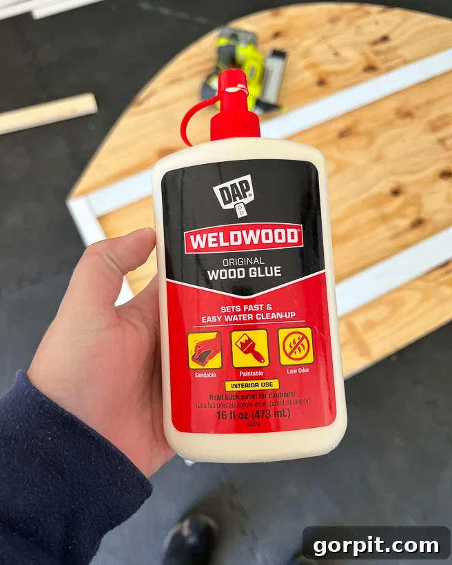 Personalized Message Headboard: Build Your Own 9 Applying DAP original wood glue to attach scrap wood to the headboard back